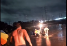 Policial de folga salva família de carro submerso durante alagamento