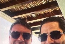Foto de Flávio com suspeito gera reação e senador nega conhecê-lo