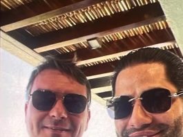 Foto de Flávio com suspeito gera reação e senador nega conhecê-lo